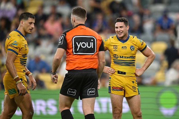 Mitchell Moses (right) debates a decision with referee Liam Kennedy late in the Eels thrilling round 10 win over the Cowboys.