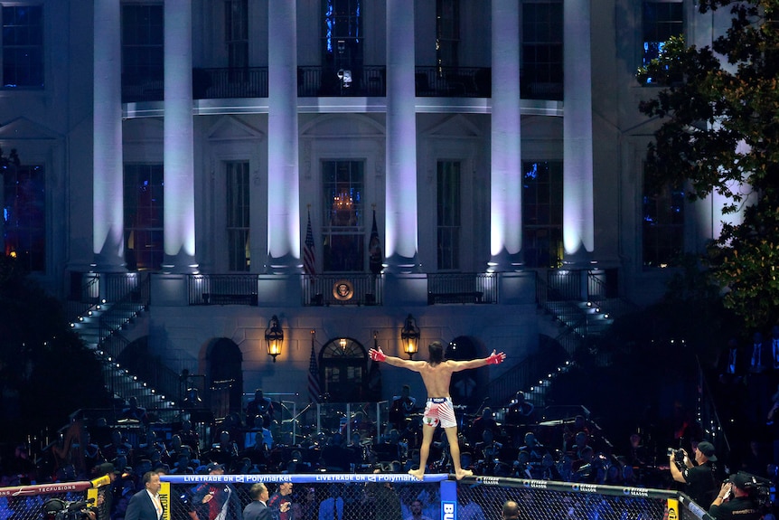 Diego Lopes stands on top of the octagon at the White House.