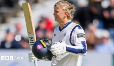 Will Luxton raises his bat after reaching a century for Yorkshire