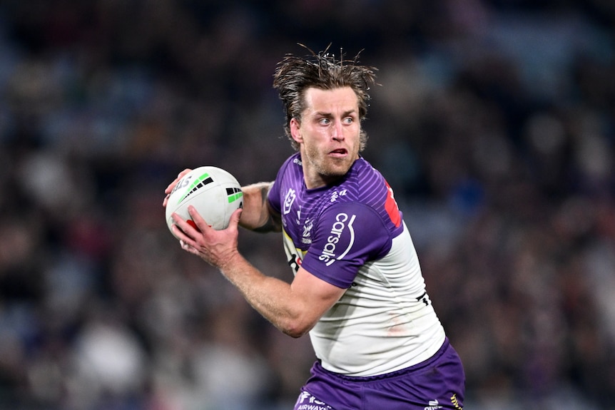 Cameron Munster of the Storm looks to pass the ball.