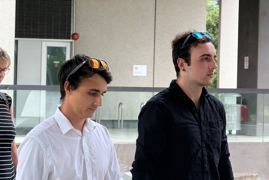 two men leaving court