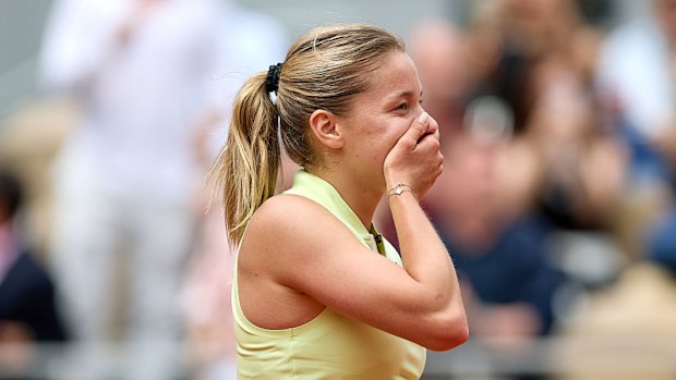 Maja Chwalinska reacts after winning match point against Anna Kalinskaya at the French Open.