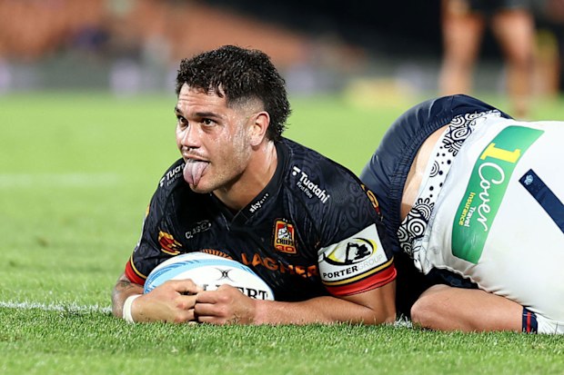 Quinn Tupaea of the Chiefs celebrates after scoring a try.