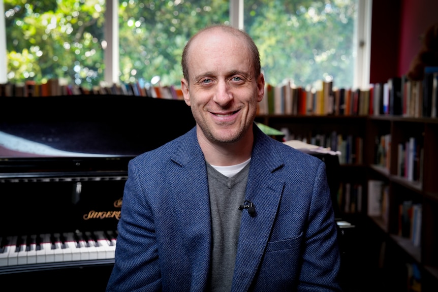 A musician smiling