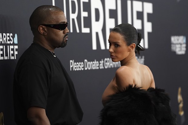 Kanye West, left, and Bianca Censori arrive at the 67th annual Grammy Awards on Sunday, Feb. 2, 2025, in Los Angeles. 