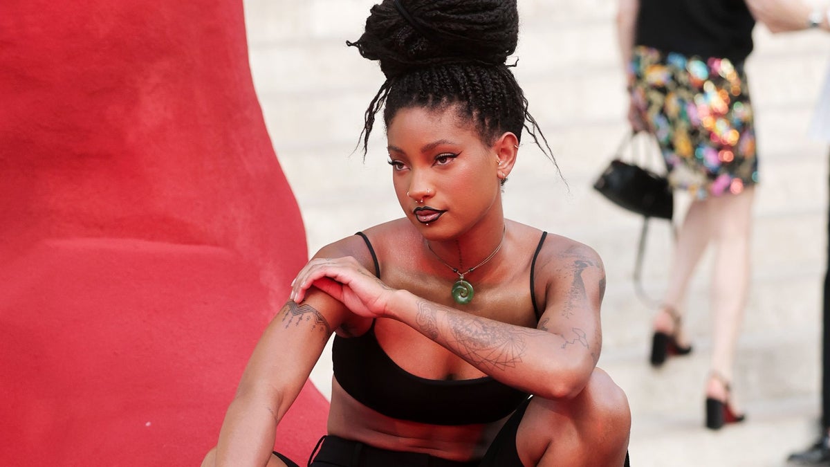 Willow Smith turns heads in crop top, tailored shorts and sculptural braided updo at Paris Fashion Week