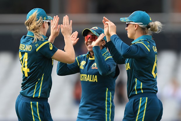 Australia's Ashleigh Gardner celebrates with tea-mates Alana King and Annabel Sutherland.