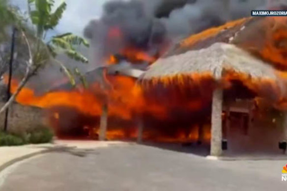 A flammable roof and windy conditions may have led to the fire spreading quickly. 