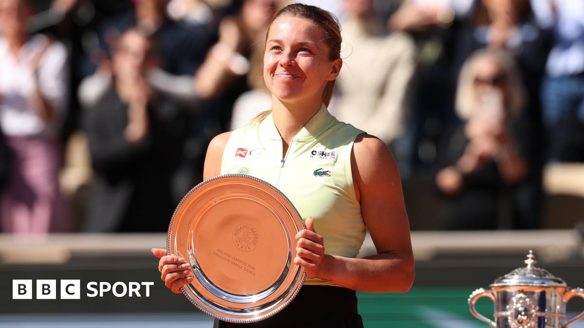 Maja Chwalinska smiles while holding the French Open women's singles runner-up trophy