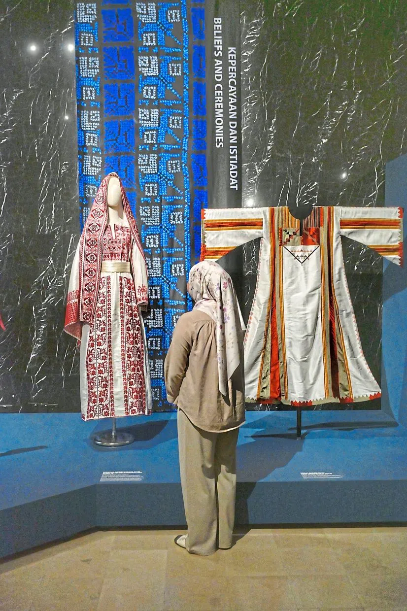 An embroidered robe can take months or even years to complete.