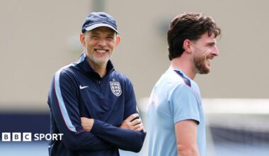 Declan Rice and Thomas Tuchel both smile during an England training session