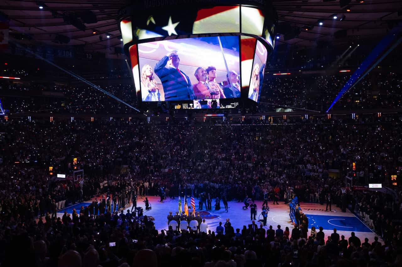 Photo of Madison Square Garden stadium with Trump projected on the jumbotron.