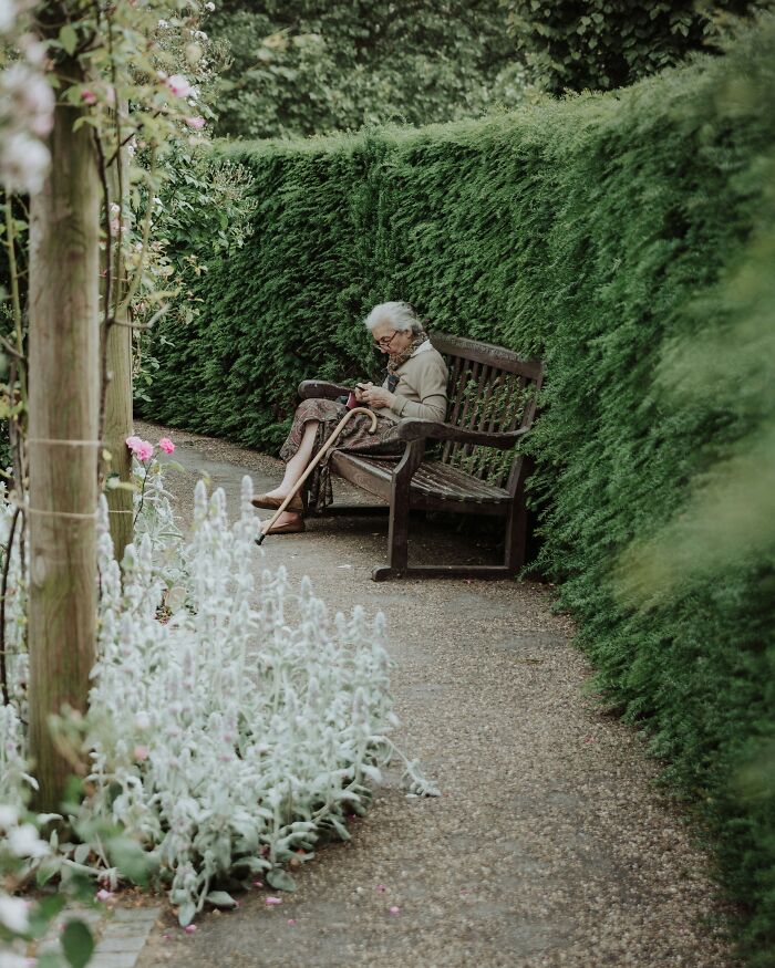 Elderly woman sitting alone in garden dementia care expert