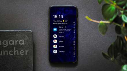 Android phone on grey background showing Niagara Launcher home screen