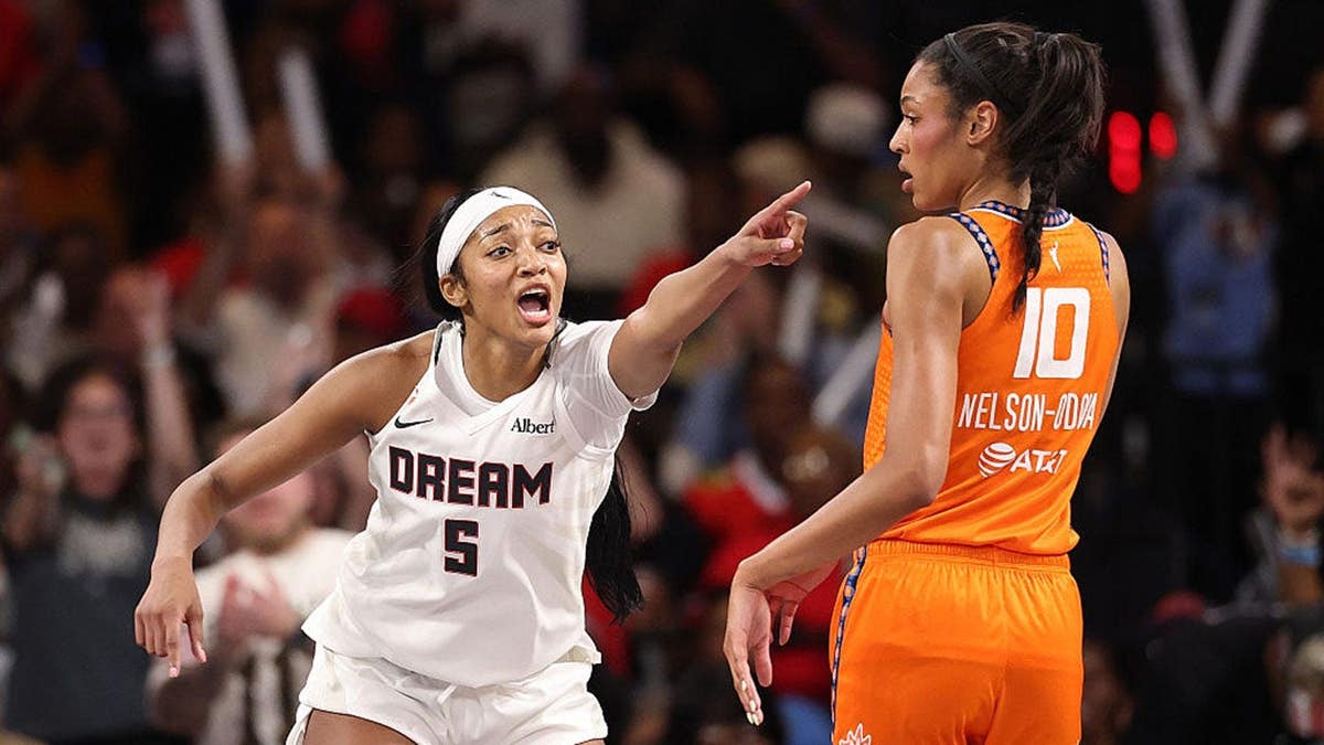 Angel Reese shooting a three-point basket during a basketball game at Gateway Center Arena