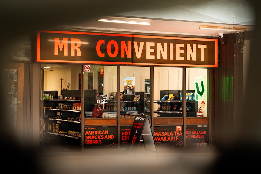 Convenience store with red and black signage