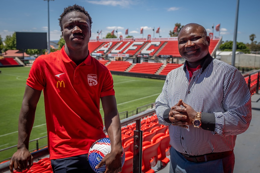 Soccer player Nestory Irankunda with father Gideon at Hindmarsh Stadium.