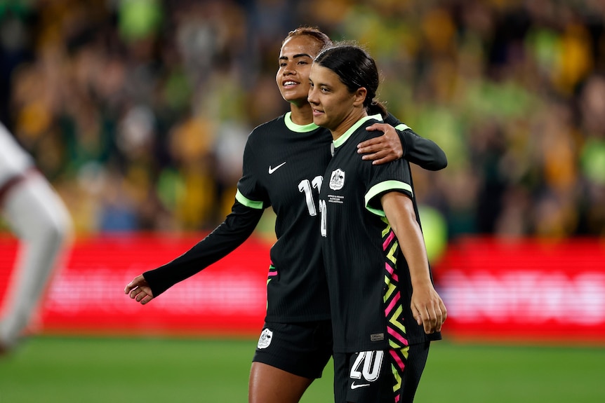 Sam Kerr and Mary Fowler hug