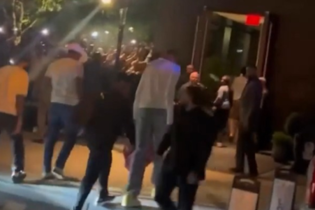 Wembanyama walks into his hotel in NYC.
