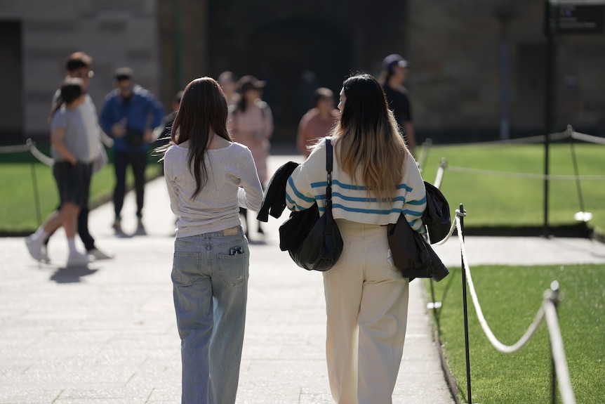 University students walking through a campus, generic.