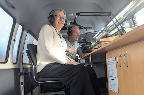 Apple 98.5 FM volunteer and Moorabool Shire councillor Moira Berry commentates a local football game with partner Wayne Hall.
