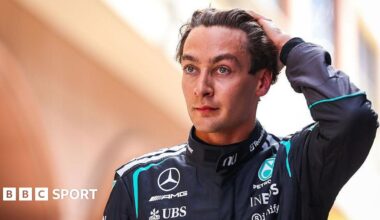 George Russell runs his hand through his hair and looks disappointed following Monaco Grand Prix qualifying