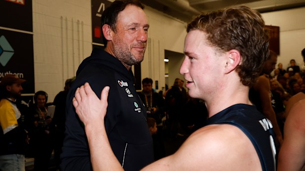 Josh Fraser and Flynn Young celebrate the win over Essendon.