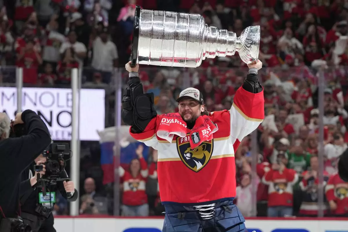 FILE - Florida Panthers goaltender Sergei Bobrovsky lifts the Stanley Cup after defeating the Edmonton Oilers in Game 6 of the NHL hockey Stanley Cup Final June 17, 2025, in Sunrise, Fla. (AP Photo/Lynne Sladky, File)