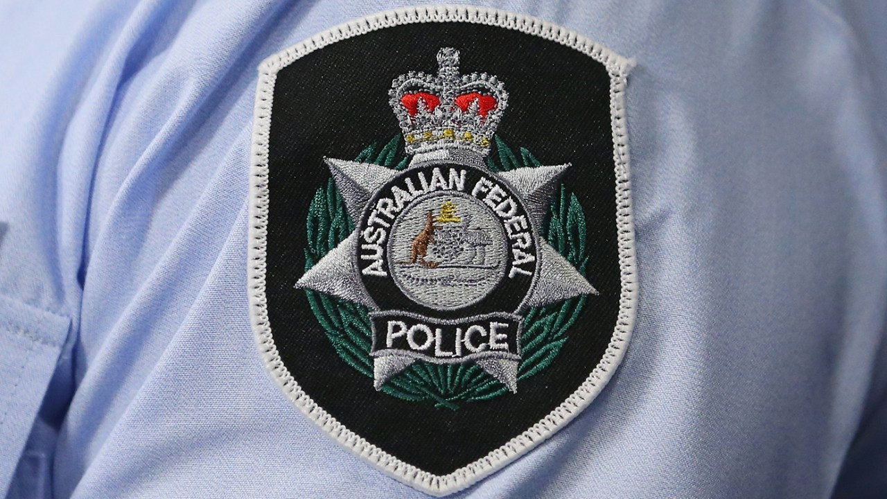 Queensland man charged after allegedly sending threatening emails, voice messages to federal politician