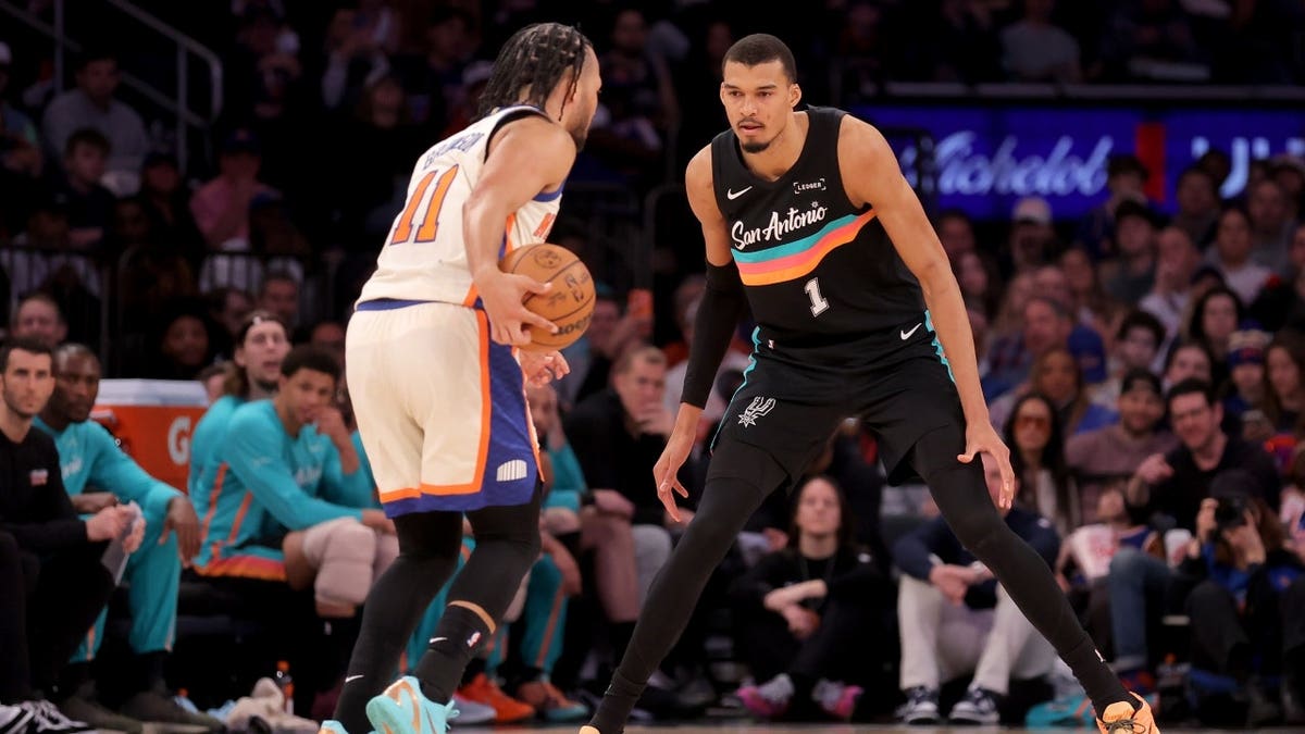 San Antonio Spurs big Victor Wembanyama defends New York Knicks PG Jalen Brunson at Madison Square Garden.