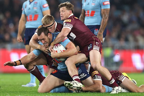 Isaah Yeo of the Blues is tackled during game one. 
