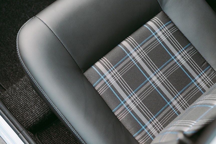 Grey and blue tartan on leather seats