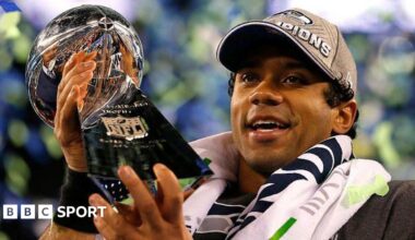 Russell Wilson holding the Lombardi Trophy after the Seattle Seahawks win the Super Bowl in 2014