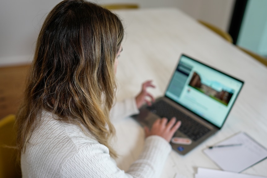 A woman on her laptop.