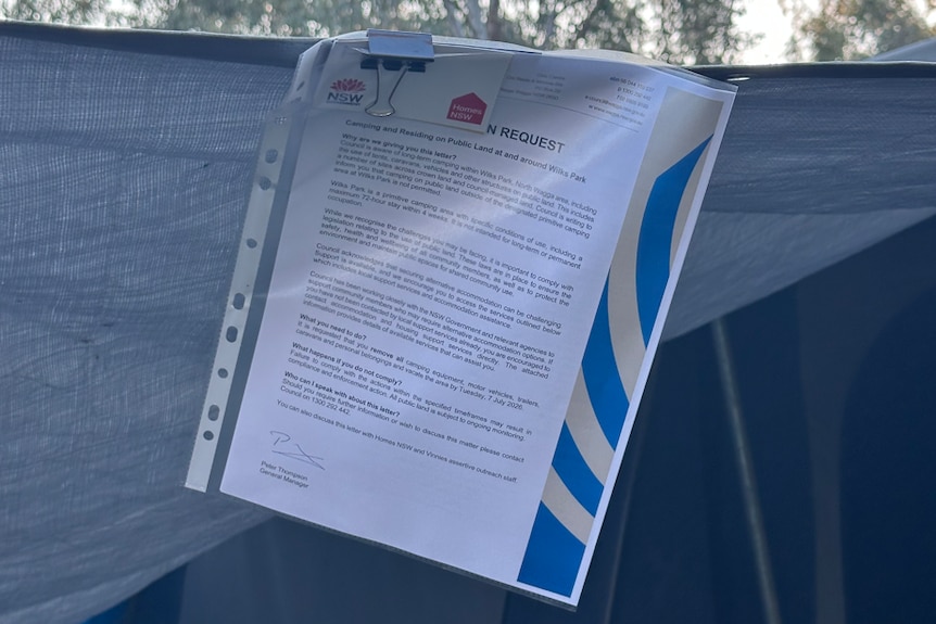 Compliance letter placed on a tent at Wilks Park