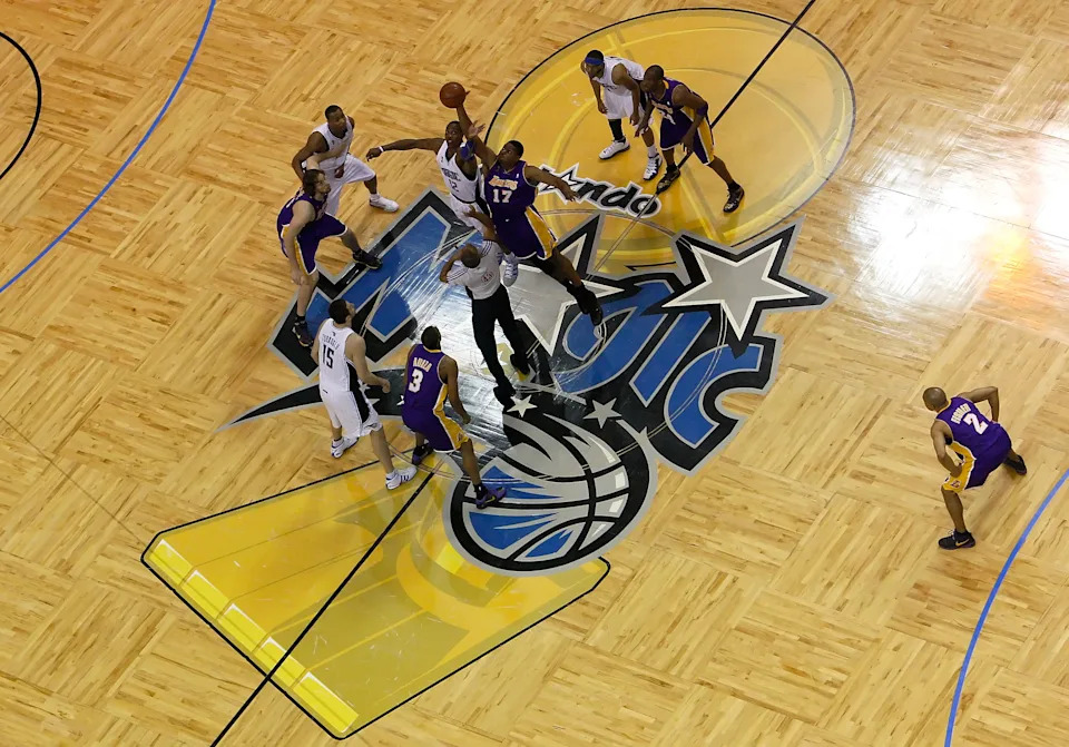 ORLANDO, FL - JUNE 14: Andrew Bynum #17 of the Los Angeles Lakers and Dwight Howard #12 of the Orlando Magic go after the tip-off to start Game Five of the 2009 NBA Finals on June 14, 2009 at Amway Arena in Orlando, Florida. NOTE TO USER: User expressly acknowledges and agrees that, by downloading and or using this photograph, User is consenting to the terms and conditions of the Getty Images License Agreement. (Photo by Ronald Martinez/Getty Images)