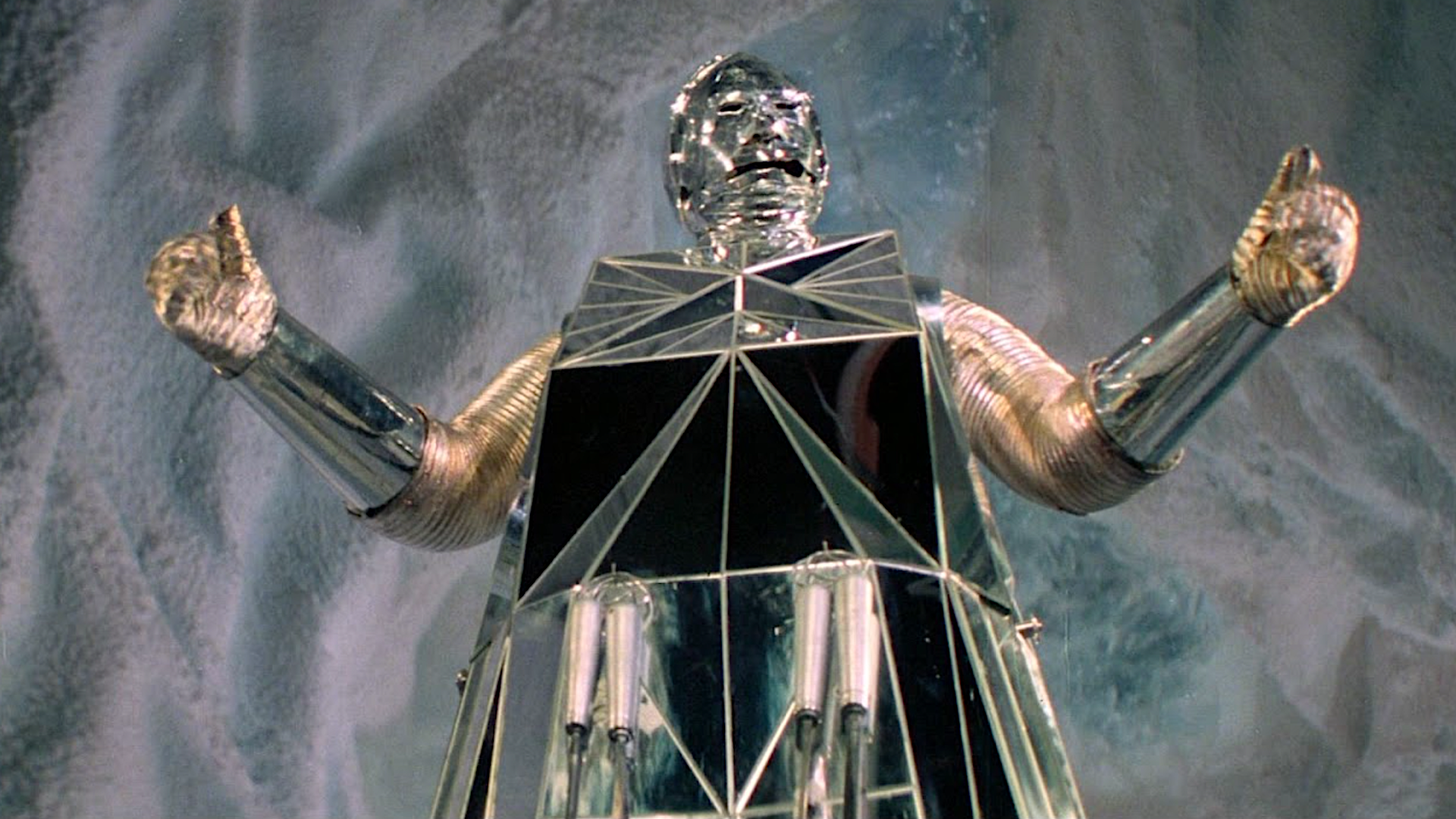 a shiny reflective robot from a sci-fi movie
