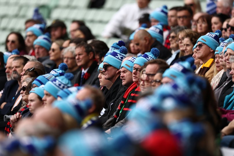 A sea of blue beanies at Neale Daniher’s State funeral.