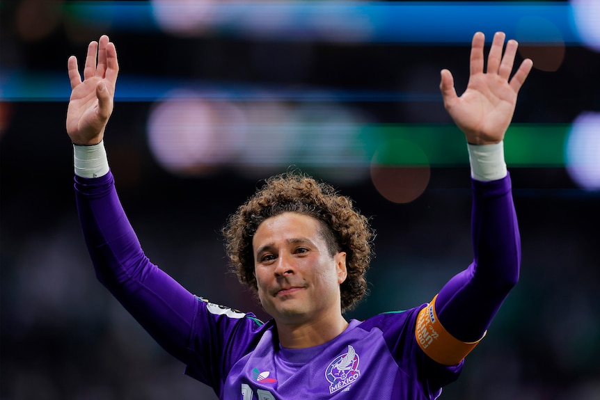 Guillermo Ochoa waves to the crowd.