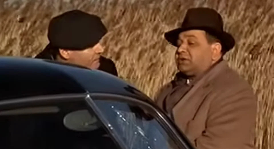 Richard Castellano talking to another man in "The Godfather"