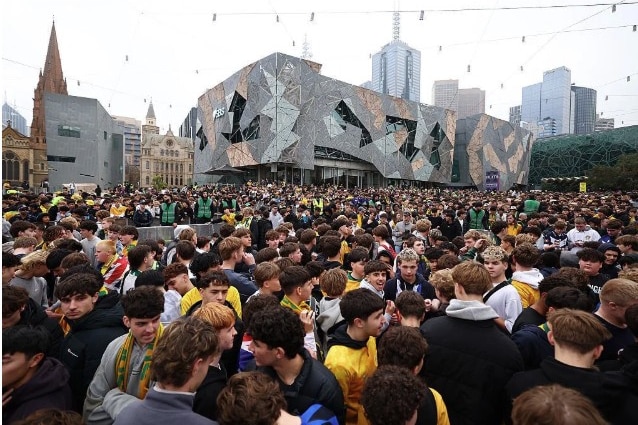 people at a packed federation square to watch the socceroos v paraguay world cup match