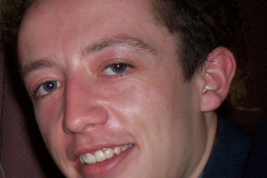 An old photo of a young man.