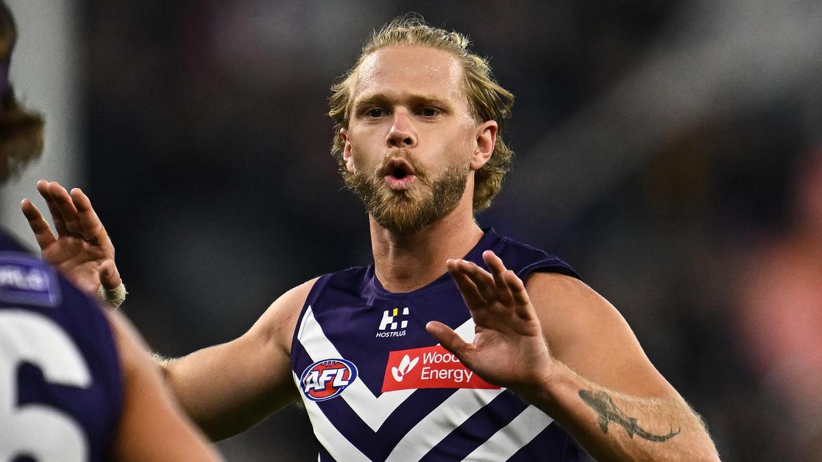 Fremantle Dockers veteran Corey Wagner, young forward Charlie Nicholls re-sign