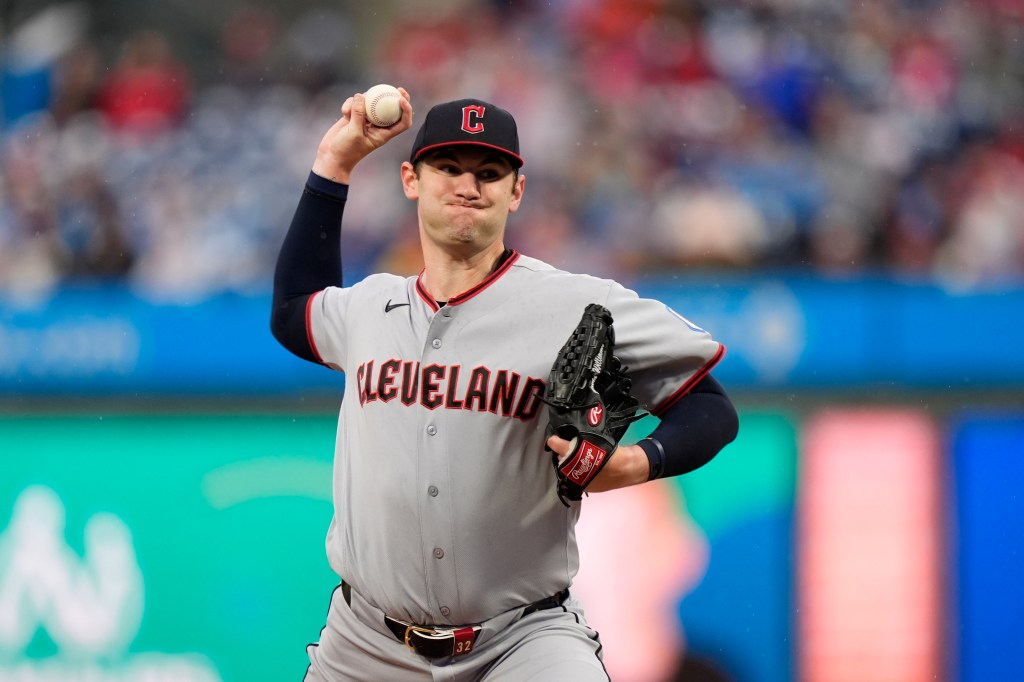 Gavin Williams pitches during a baseball game.