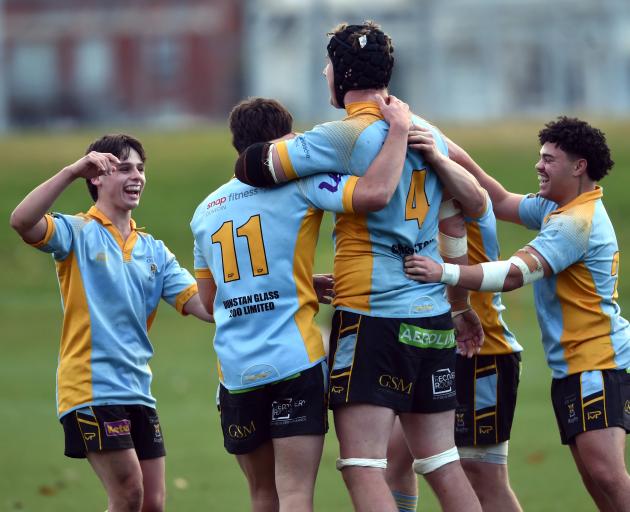 University celebrate during their Division 1 premier club rugby match against Dunedin at the...