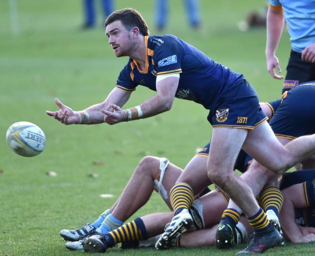 Dunedin halfback Tim Hogan passes the ball during the Division 1 premier club rugby match between...