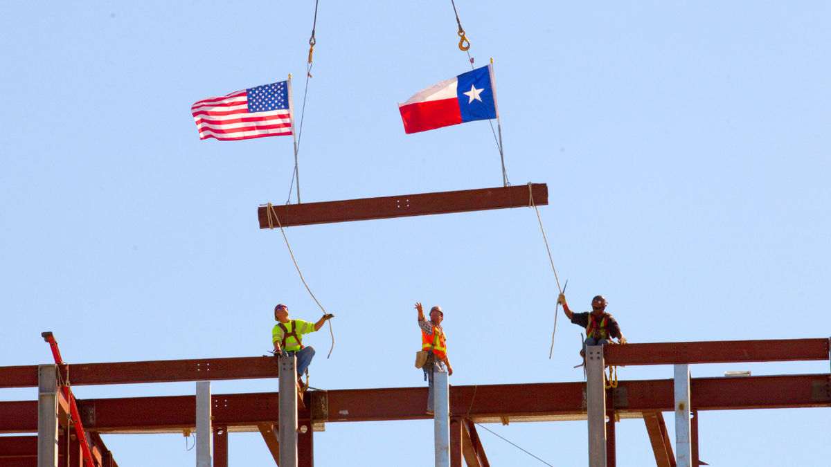 Construction site with cranes and building framework in Texas