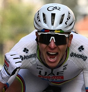 UAE Team Emirate's Slovenian rider Tadej Pogacar celebrates as he crosses the finish line to win the 117th Milan - Sanremo one-day classic cycling race, in Sanremo on March 21, 2026. (Photo by Marco BERTORELLO / AFP)