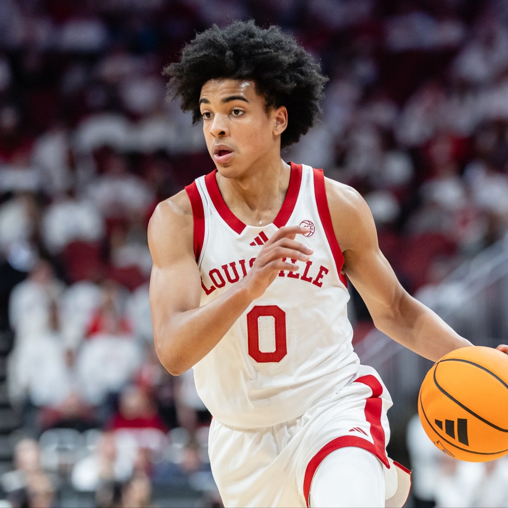 Mikel Brown Jr. #0 of the Louisville Cardinals brings the ball up court during the game against the NC State Wolfpack at KFC YUM! Center on February 9, 2026 in Louisville, Kentucky.