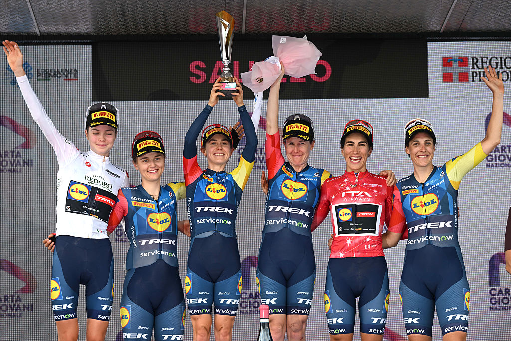 SALUZZO, ITALY - JUNE 07: Niamh Fisher-Black of New Zealand, Elisa Balsamo of Italy, Lucinda Brand of Netherlands, Isabella Holmgren of Canada, Fleur Moors of Belgium, Amanda Spratt of Australia and Team Lidl - Trek celebrate at podium as best team pize winners during the 37th Giro d&amp;apos;Italia Women 2026 - Stage 9 a 145km stage from Saluzzo to Saluzzo / #UCIWWT / on June 07, 2026 in Saluzzo, Italy. (Photo by Luc Claessen/Getty Images)